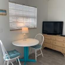 Dining area with TV on dresser