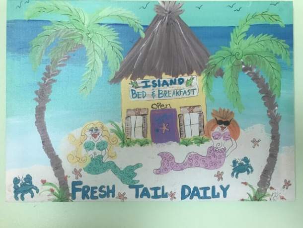 Painted sign that reads Island Bed and breakfast, fresh tail daily